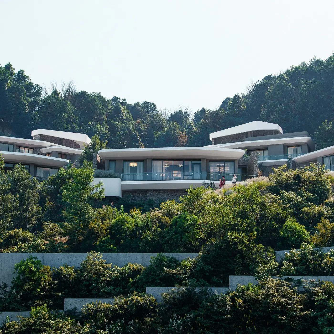돌담과 소나무 사이, 저녁 무렵 세레니티 리조트 객실동 파사드